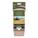 Pack of Hebrides Hiker socks in beige and black Fair Isle pattern, displayed with a scenic backdrop.