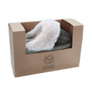 Olive green tartan mule slipper with a faux fur lining, presented in a brown cardboard box.