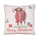 A square cushion featuring a brown highland cow wearing a red scarf, with festive decorations and gifts in a soft pastel design.
