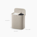 A beige laundry basket with two compartments, lid, and soft fabric covering, measuring 73.9 cm tall and 60 cm wide.