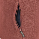 A close-up of a dark  fleece jacket with a half zip and side pocket.