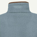 Close-up of the high collar on a light blue textured fleece pullover with contrasting brown trim.