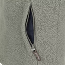 Close-up of zipped side pocket on a sage green women’s fleece pullover, showing contrasting dark pocket lining.
