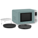 Pastel green Smeg microwave oven shown with metal rack, baking tray and perforated cooking tray accessories.