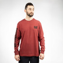 Male model wearing a red CAT long sleeve T-shirt with black CAT chest logo and Caterpillar sleeve branding, front view.