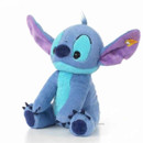 Steiff Disney Originals Stitch plush toy shown seated at an angle, featuring blue and turquoise fur, large purple-lined ears and dark blue claws.