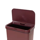 A close up view of a burgundy tower bin with the lid open