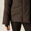 Close-up of dark brown padded jacket showing the quilted sleeve, hem and extended cuff.