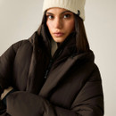 Close-up of woman wearing a dark brown padded jacket showing the high collar, hood and quilted design.