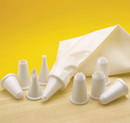 KitchenCraft piping set with reusable bag and eight assorted plastic nozzles displayed on a wooden surface.