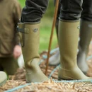 Le Chameau men's Vierzonord green wellington boots being worn outdoors, showing the adjustable calf gusset and strap.