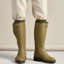 Le Chameau men's green wellington boots being worn from the front, showing the tall design and rugged treaded soles.