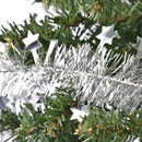 Silver tinsel, with foil stars, draped on a Christmas Tree.