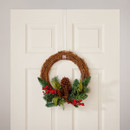 Clear over-the-door wreath hanger supporting a festive Christmas wreath on a white panel door, providing a discreet, damage-free hanging solution for seasonal decorations.
