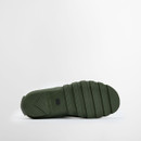 Underside view of a green Barbour wellington boot highlighting the deep tread rubber sole designed for grip and stability.