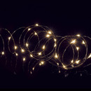 Warm white LED micro wire fairy lights on flexible silver wire, ideal for wrapping around Christmas trees, wreaths, table centrepieces and festive indoor decorations.