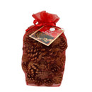 Scented pine cones presented in a red organza drawstring gift bag with decorative Christmas tag, suitable for festive home décor and seasonal fragrance displays.