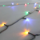 Close-up of multicolour LED Christmas string lights featuring red, blue, green and amber bulbs on a green cable for bright seasonal displays.
