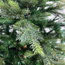 Detailed view of realistic pine branches on an artificial Christmas tree, highlighting varied needle textures and natural colour tones.