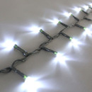 Close-up of white LED Christmas tree lights on a green cable, showing bright cool white bulbs and compact spacing for festive indoor or outdoor displays.