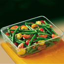 Pyrex rectangular glass oven dish filled with roasted vegetables, suitable for cooking and serving meals.