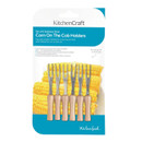 KitchenCraft set of six stainless steel corn-on-the-cob holders with light wooden handles and two metal prongs each, displayed in blue and white retail packaging featuring a photograph of yellow sweetcorn.