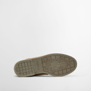 Rubber outsole of Barbour Readhead tan chukka boot featuring engraved Barbour logo and heritage figure tread pattern.