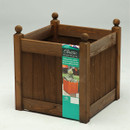 Chestnut stained square wooden garden planter with vertical slats and rounded corner finials, shown with the product sleeve attached.