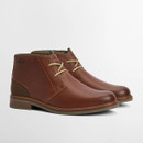 A pair of brown lace up boots.