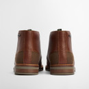 The back of a pair of brown lace up boots.