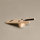 Side view of Le Chameau wooden boot jack showing the raised support, forked opening and non-slip rubber pads.