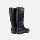 A pair of tall, dark rubber wellington boots with brown soles and details stand against a white background, conveying a practical and rugged tone.