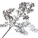Close-up of a silver glitter Christmas foliage spray featuring sparkling leaves and intricate branching stems for elegant seasonal decorating.