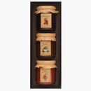 Three jars of festive preserves in a black presentation box, including Christmas Chutney, Cranberry & Port Sauce, and Boxing Day Chutney.