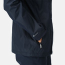 Close-up of a person wearing a navy waterproof jacket with hands in zippered pockets. The background is a plain white, emphasizing the jacket's design.
