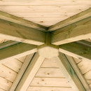 Interior view of the wooden roof structure of a gazebo showing the central support beams and framework.
