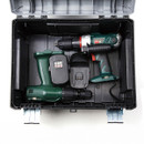 Open black toolbox containing a green and black cordless drill with two rechargeable batteries. The tools are neatly organized inside.