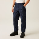 Front view of navy blue men’s cargo work trousers with button waist, belt loops, slanted hand pocket, reinforced knee panels, and durable utility fabric paired with black work boots