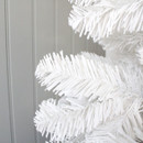 Part of a white artificial Christmas tree against a grey panelled wall.