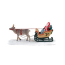 Opposite side view of a Christmas village reindeer and sleigh accessory carrying presents, with decorative harness and festive sleigh details.