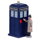 A classic blue British police box with a figure in vintage attire reaching for a red phone on the side.