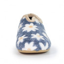 Front view of a cosy women's slipper with a fuzzy navy blue upper adorned with large white daisies featuring orange centres, trimmed with beige faux fur and a light tan rubber sole.