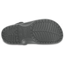 Close-up of a grey sandal sole showcasing detailed tread patterns designed for grip and traction. The image focuses on wear and functionality.