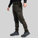 Side view of camouflage CAT work trousers showing cargo pocket, reinforced knee panels and tapered leg fit.