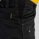 Close-up of black CAT work trousers side waist showing reinforced stitching, tool loop and zipped pocket with branded CAT pull