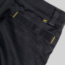 Close-up of articulated knee panel on black CAT work trousers with reinforced stitching and durable fabric
