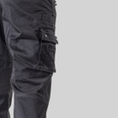 Close-up of reinforced knee panel on black CAT trousers with durable fabric and stitched detailing