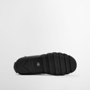 Underside view of a black Barbour wellington boot displaying the deep-tread rubber outsole designed for grip on wet terrain.