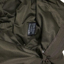 Close-up of olive green outdoor trousers showing dark reinforced knee panels with articulated stitching.