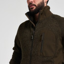 Close-up of a men’s dark olive green fleece jacket showing the high collar, full zip and vertical chest pocket.